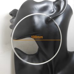 Handcrafted 100mm large round threader hoop earrings made from smooth, shiny 925 sterling silver, displayedΒ on a black mannequin.