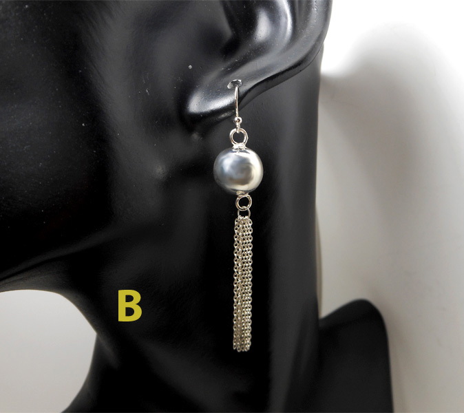 A pair of handcrafted 925 sterling silver drop earrings featuring a high-polished smooth bead paired with a delicate multi-strand chain tassel design.