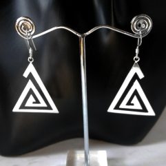 A pair of handcrafted 925 sterling silver cutout swirl triangle drop earrings displayed on a silver display stand against a dark background.