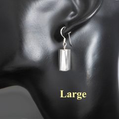 A pair of handcrafted 925 sterling silver hollow cylinder drop earrings with a high-polished finish, shown on a mannequin.