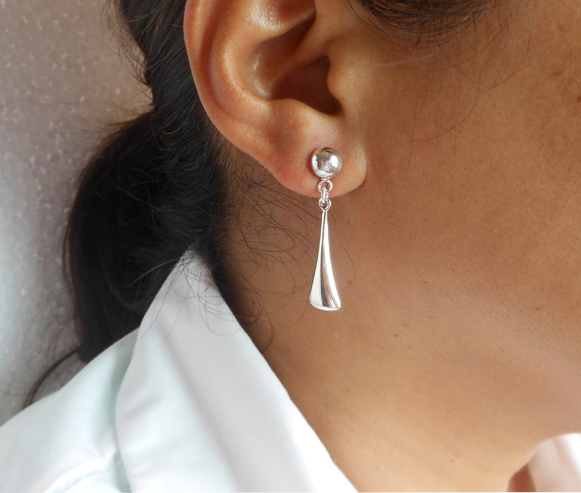 Handcrafted 925 sterling silver puffy tapered cone dangle earrings with ball stud worn on display model