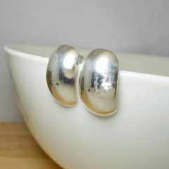 Pair of handmade 925 sterling silver convex dome rectangle stud earrings with a highly polished mirror finish.