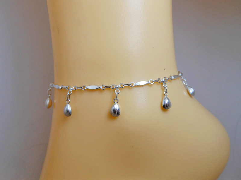 925 Sterling Silver scallop shell charm anklet on a wrist