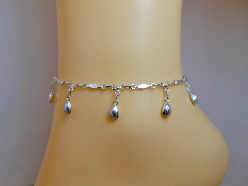 925 Sterling Silver shell charm anklet worn on an ankle, front view