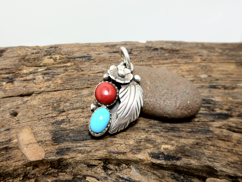 Artisan turquoise and coral flower pendant, left-facing orientation