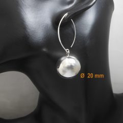 A pair of handcrafted 925 sterling silver drop earrings featuring a large 20mm polished sphere, worn on a black mannequin ear.