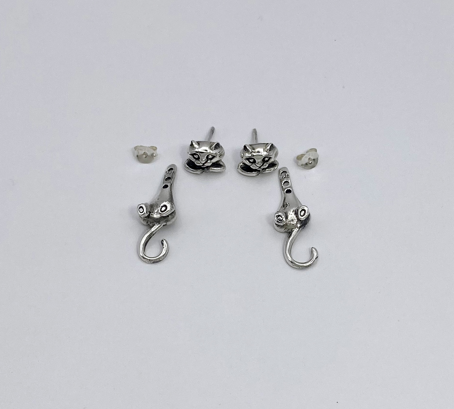 Close-up of cat earring jacket components