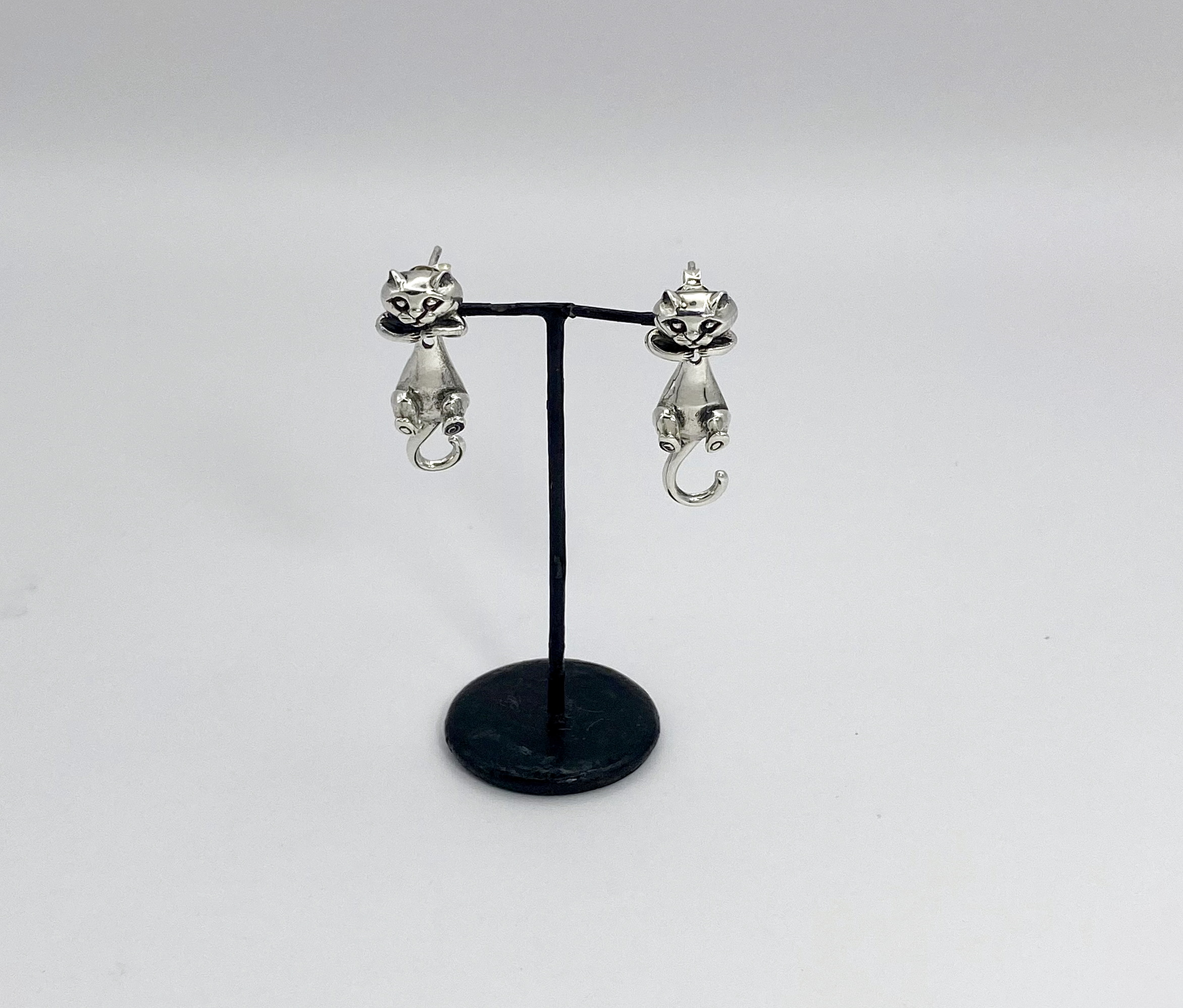 925 sterling silver cat earring jackets on display stand