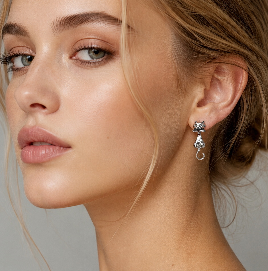 Close-up portrait of model wearing cat earring jackets