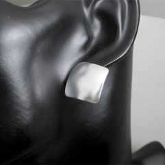 Pair of handmade 925 sterling silver dome square stud earrings with a smooth, high-polished finish.