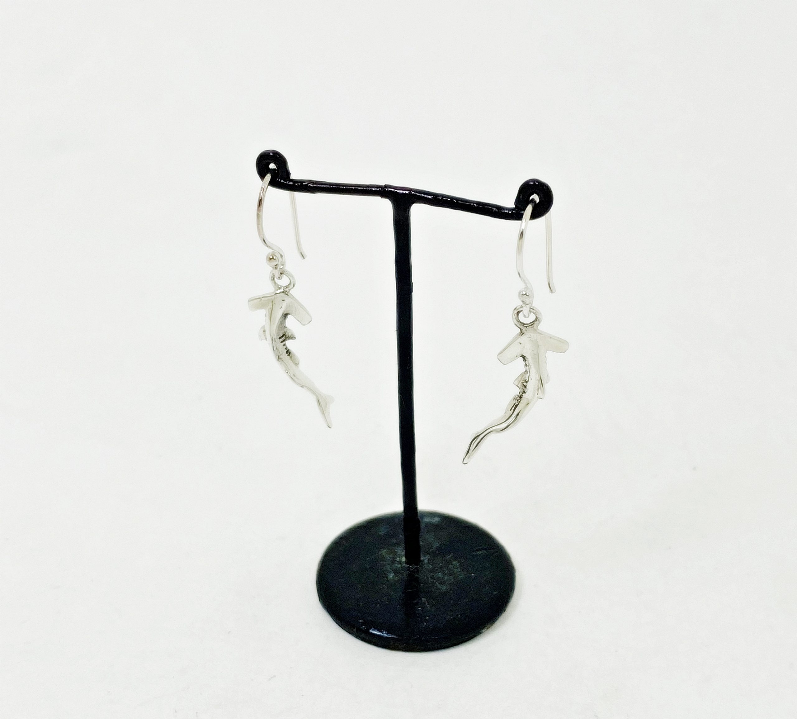 Hammerhead shark silver drop earrings right side view on display stand
