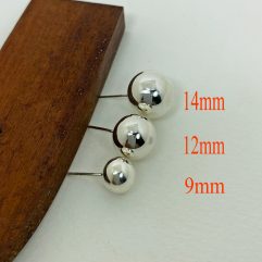 A collection of three handcrafted 925 sterling silver ball stud earrings in graduating sizes of 9mm, 12mm, and 14mm, displayed on a wooden surface.