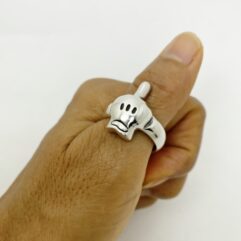 Unique middle finger cartoon hand skull ring handcrafted from 925 sterling silver, showcased on a model's finger by Sup Silver.