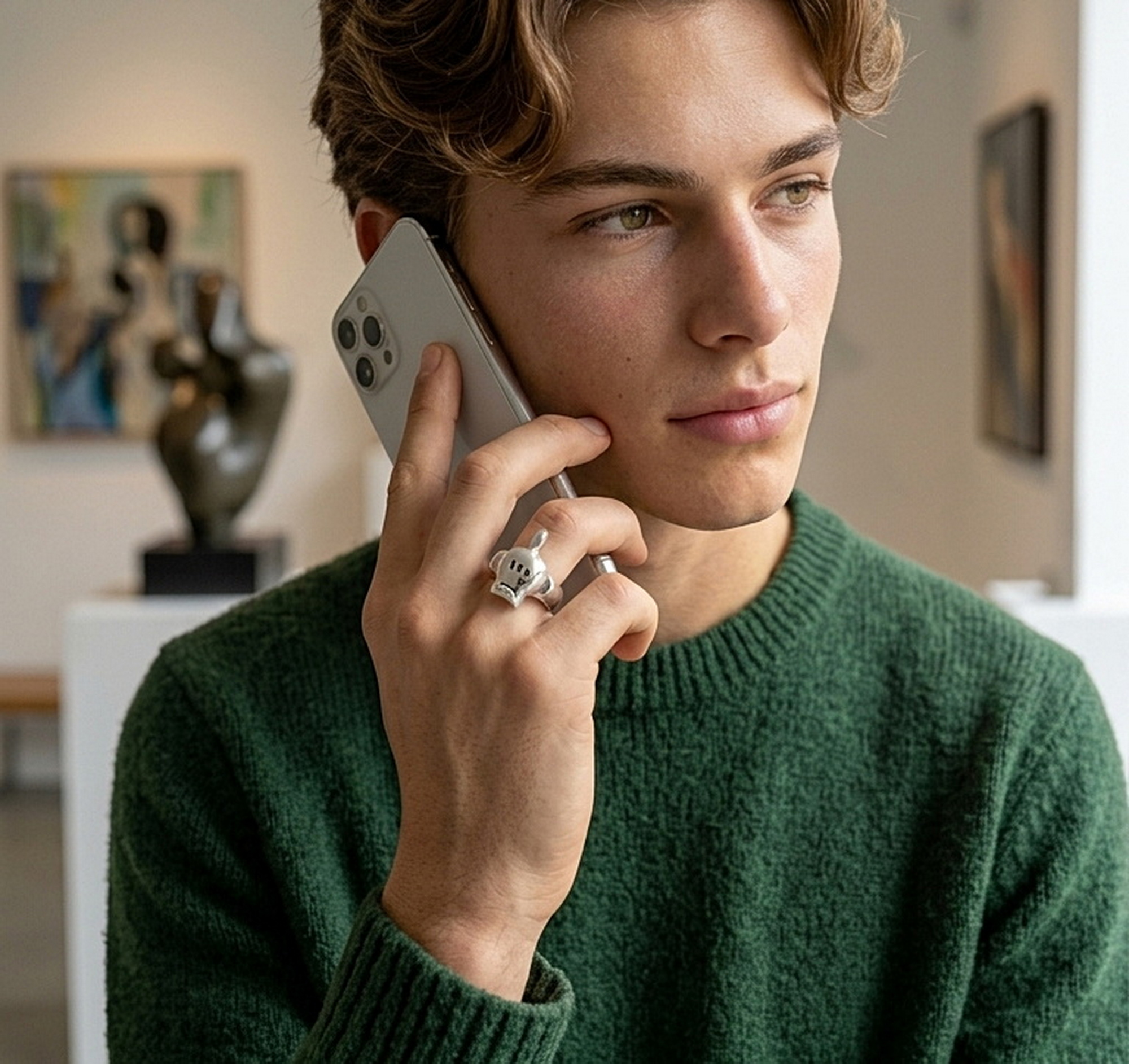 r308k-cartoon-hand-skull-ring-handcrafted-925-silver Close-up of 925 sterling silver texture on r308 ring, handcrafted by Sup Silver and shown on model's finger.