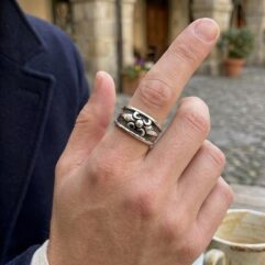 Lifestyle shot of a man wearing a handmade 925 silver Gothic ring with casual attire.