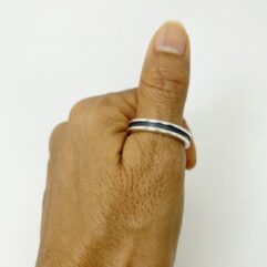 Minimalist 925 sterling silver ring with a sleek black oxidized line detail.