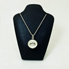 Front view of 20mm plain 925 sterling silver sound ball pendant on a black jewelry display bust.