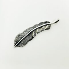 Front view of a handcrafted 925 sterling silver curved feather pendant with a detailed oxidized finish.