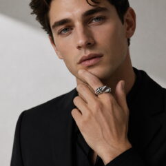 Close-up lifestyle shot of the artisan silver ring on the index finger.
