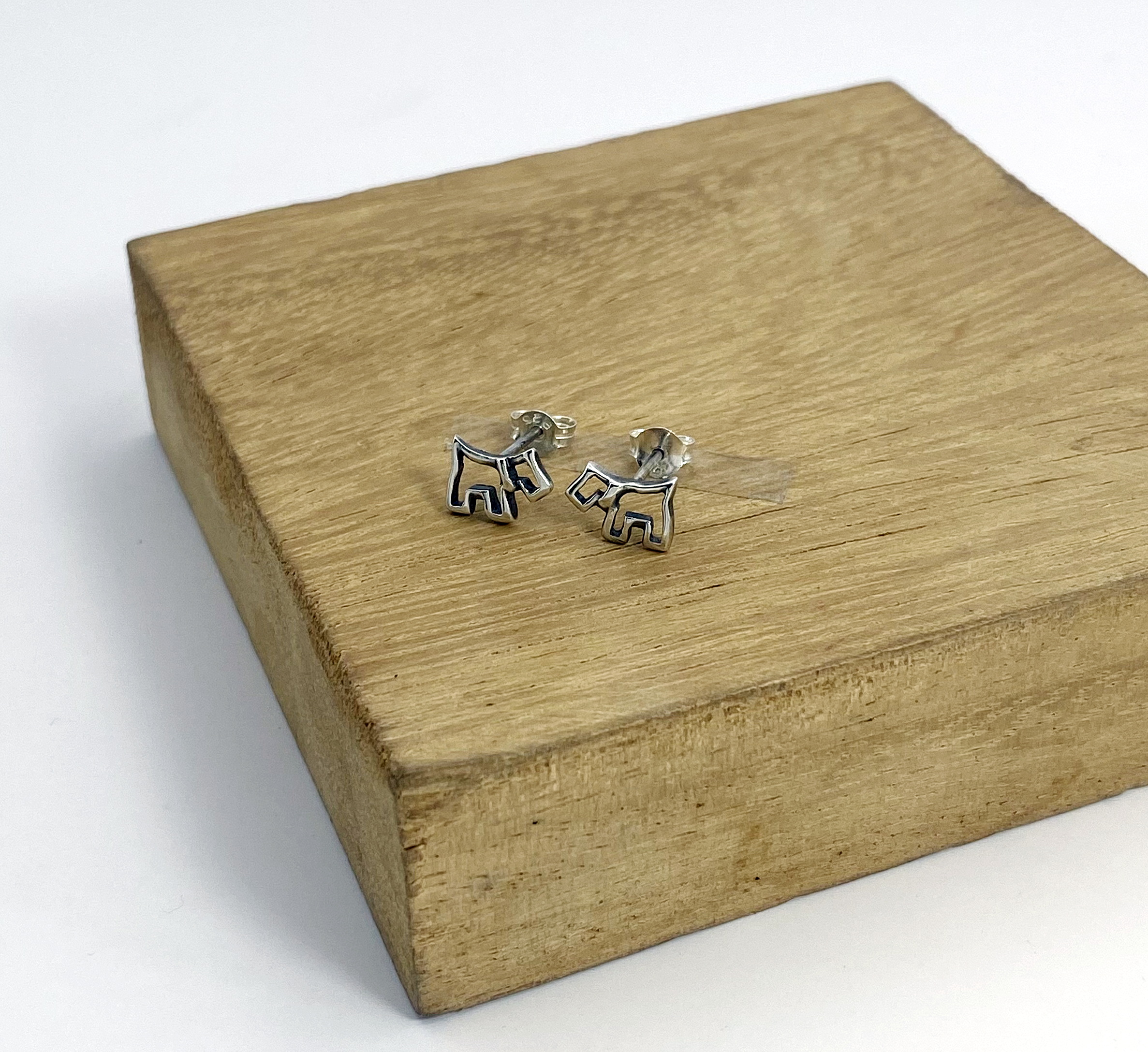925 sterling silver scottish terrier dog stud earrings on wooden display background sup silver