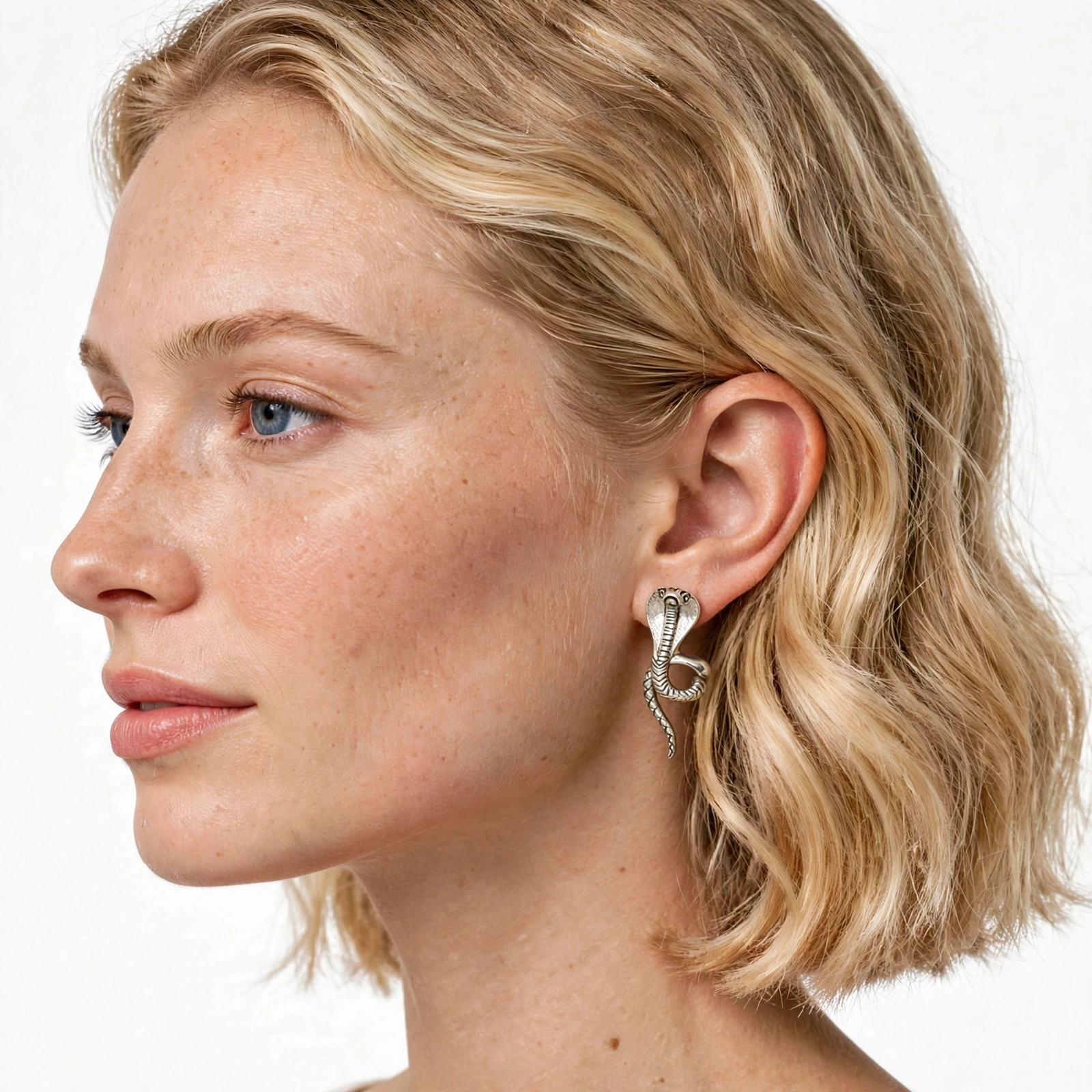 Side-profile view of a model wearing the handcrafted king cobra snake earring jackets.